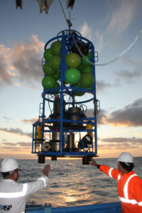 instrumentation being lowered into the ocean