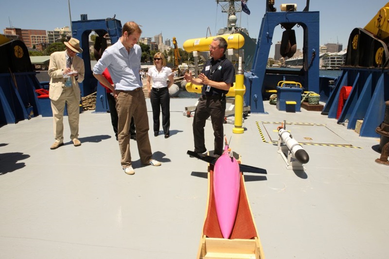 People on ship's deck with scientific equipment