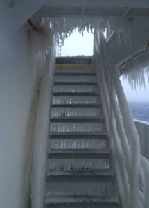 Stairs on a ship that are iced over