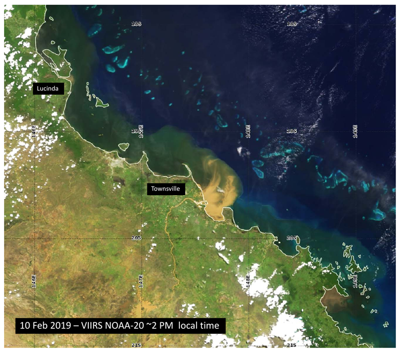 A satellite image of the coast of Queensland near Townsville. A brown plume swirls into the blue/green water near the coast at the mouth of the Burdekin River.