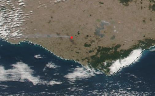 Aerial image of south-west Victoria. A red dot shows Cobden and there is a trail of smoke blowing to the west.
