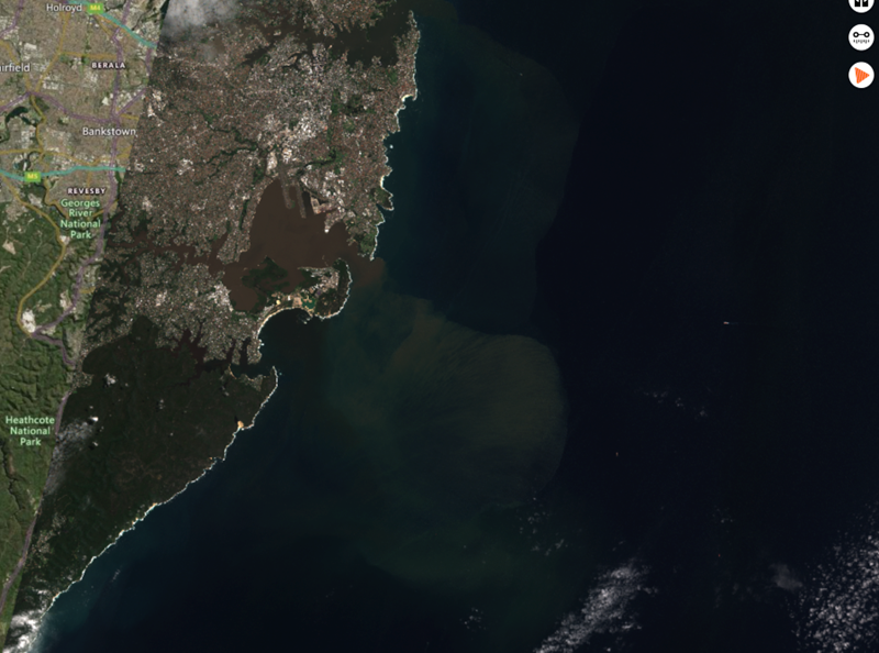A satellite image of southern Sydney, showing Botany Bay choked with black carbon and sediments.
