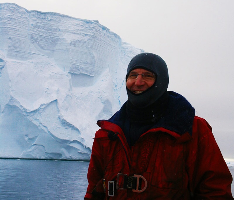 Man in front of glacier