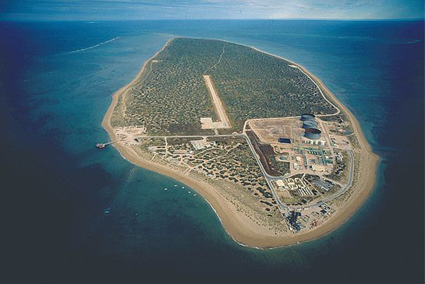 aerial view of island surrounded by blue seas