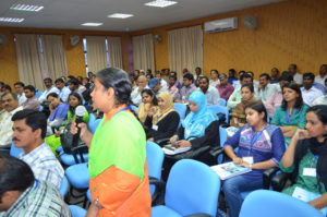 Women asks a question in a workshop