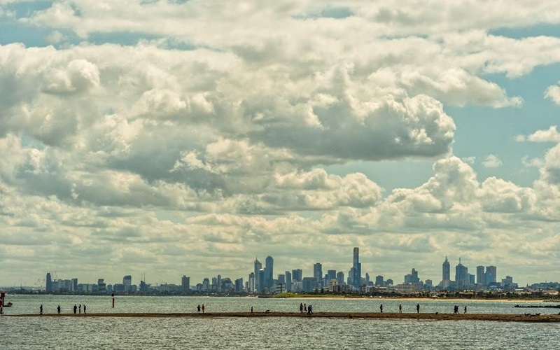 landscape imae of city in the background with clouds
