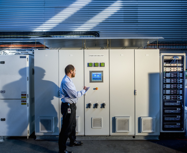 man standing in front of standup computer