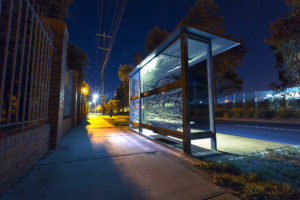 A bus stop at night in deserted street