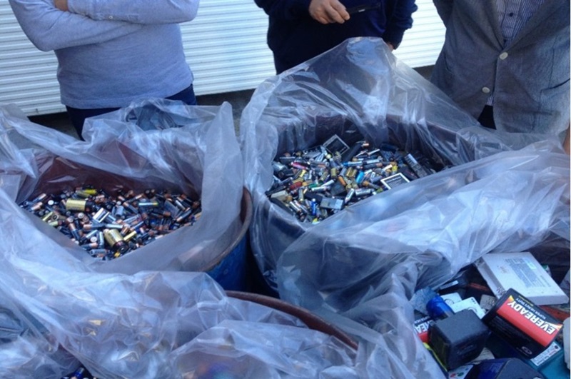 Three large plastic sacks of spent batteries