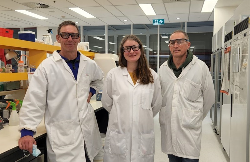 Three nitrogen team members in a laboratory.