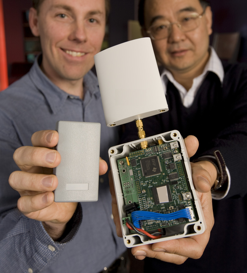 Researchers holding up WASP.