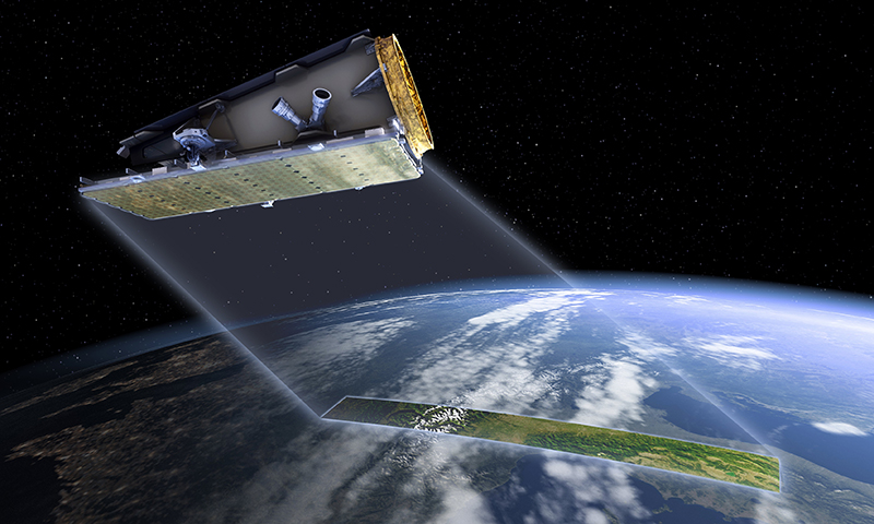 An artists impression of a satelitte in space above the curved surface of earth.