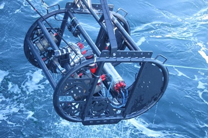 The deep tow camera system is pictured over water